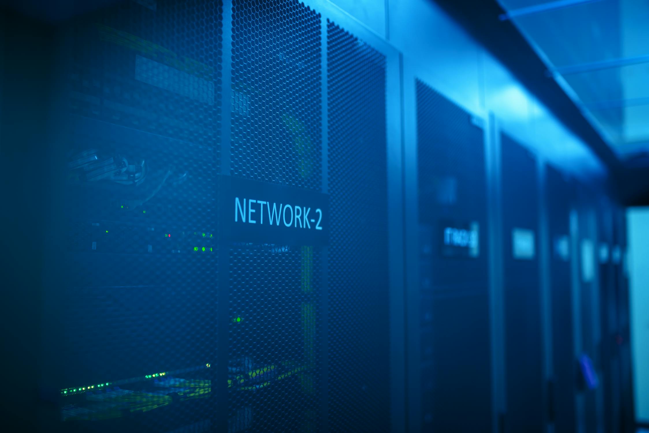 Server room with network equipment and blue illumination
